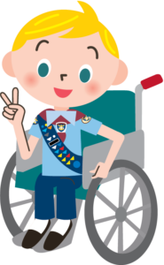 A cartoon boy in an Adventurer uniform sitting in a wheelchair and holding up his index and middle fingers on his right hand.